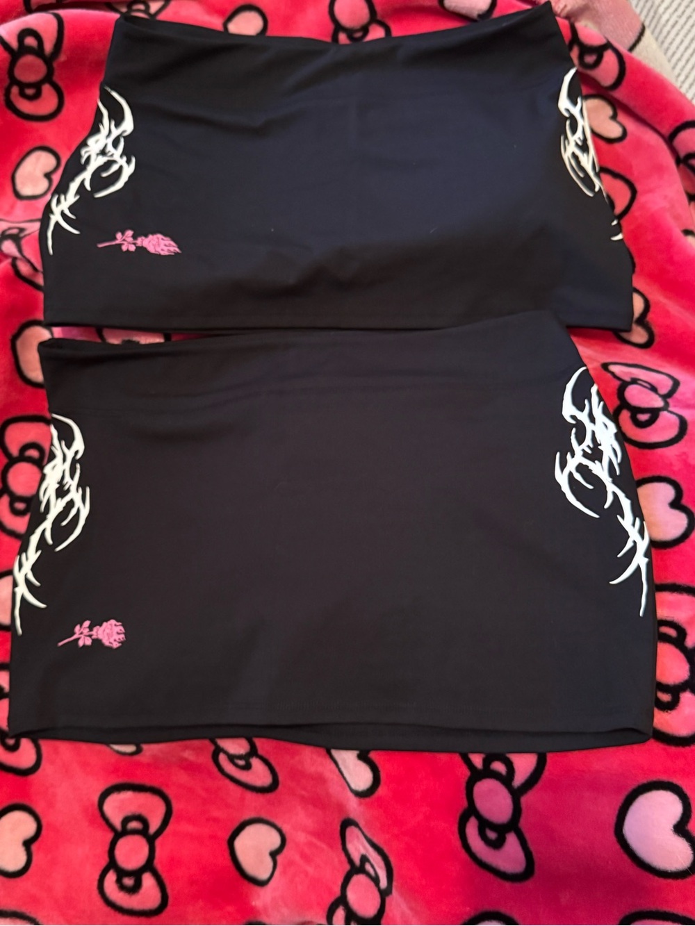 Civil Regime Black Mini Skirt with White Tribal Accents and Pink Floral Detail